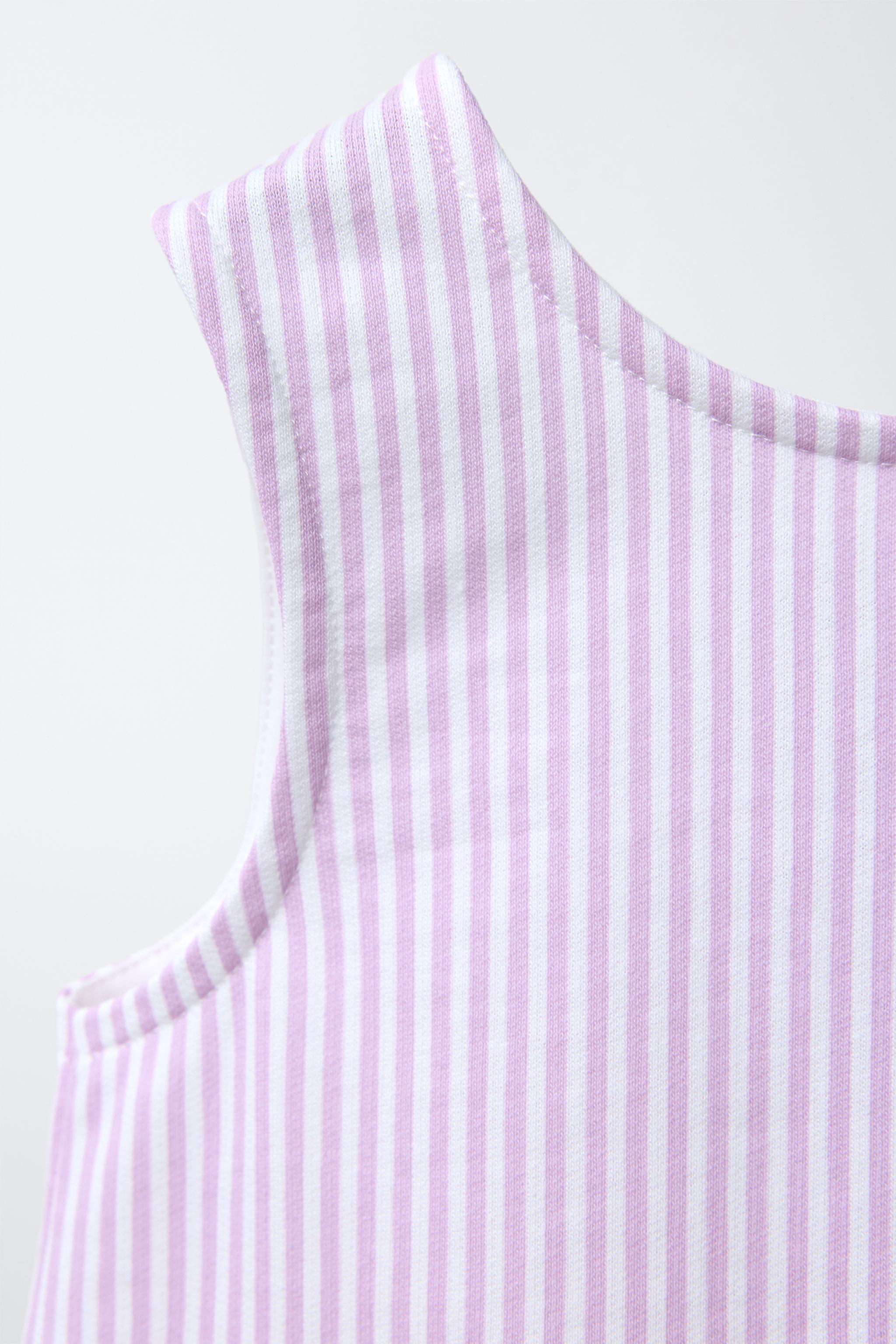 STRIPED PEPLUM TOP WITH CONTRAST LACE